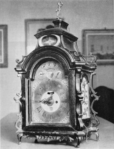 Figure 29.—Table clock by Bertolla in the collection of Doctor Vittorio dal Lago of Bergamo. The dial indicates the days of the week and of the month, the names of the months and lunar phases. The clock strikes the hours and quarters and repeats. (Courtesy of Sig. Luigi Pippa of Milan.)