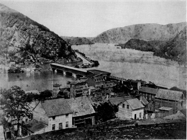 Figure 8.—The Baltimore and Ohio Railroad’s Potomac River crossing at Harpers Ferry, about 1860. Bollman’s iron “Winchester span” of 1851 is seen at the right end of Latrobe’s timber structure of 1836, which forms the body of the bridge. (Photo courtesy of Harpers Ferry National Historical Park.)